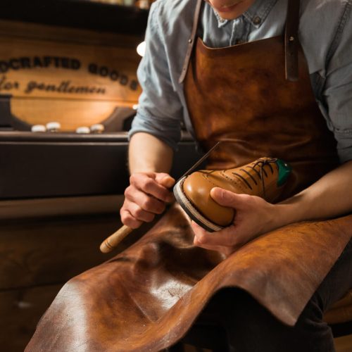 bootmaker-in-workshop-making-shoes-2021-08-26-18-21-43-utc