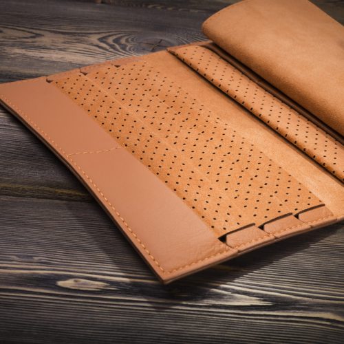 New leather wallet on rustic wood background